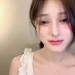 Petite Japanese Girl with Lace Bra Rides Pink Vibrator in Bedroom