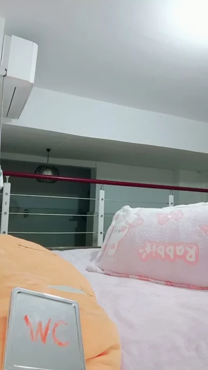 Screenshot 5 from Xinyi’s Leaked Solo Tape: Asian Amateur Masturbates in Lingerie on Pink Bedding