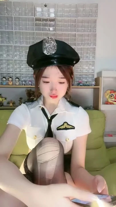 Screenshot 2 from Petite Asian Cam Girl Roleplays as Police Officer in Teasing Livestream