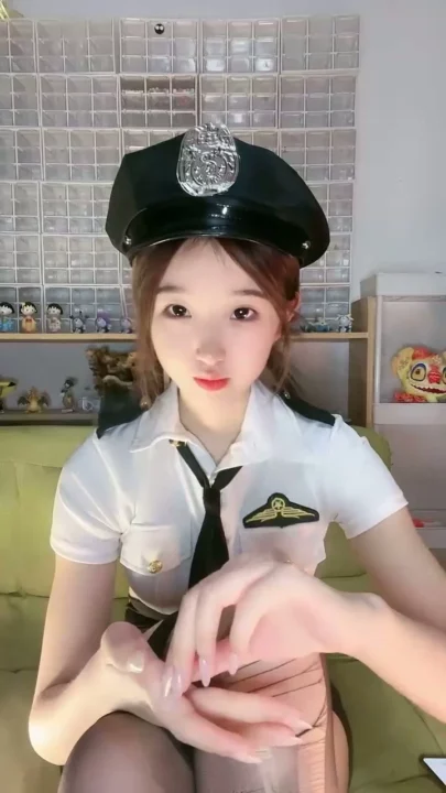 Screenshot 5 from Petite Asian Cam Girl Roleplays as Police Officer in Teasing Livestream