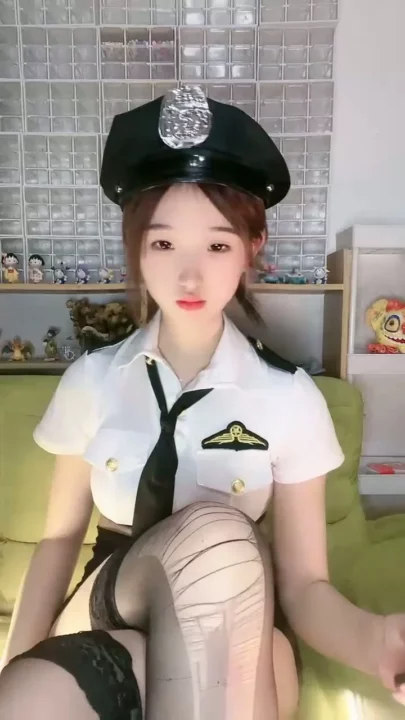 Screenshot 6 from Petite Asian Cam Girl Roleplays as Police Officer in Teasing Livestream
