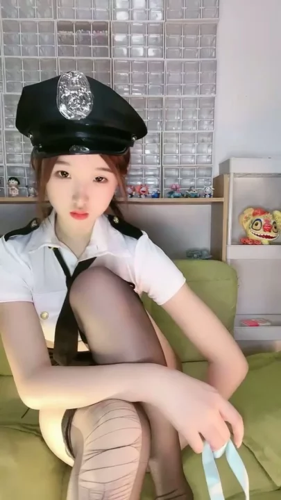 Screenshot 7 from Petite Asian Cam Girl Roleplays as Police Officer in Teasing Livestream