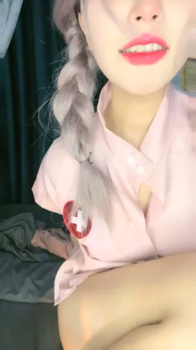 Solo Asian Nurse in Pink Teases with Dildo — Stockings & Shaved Pussy on Display のスクリーンショット 3