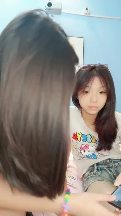 Screenshot 4 from Petite East Asian Twins in Raw Hotel Lesbian Encounter — Full Face Visible