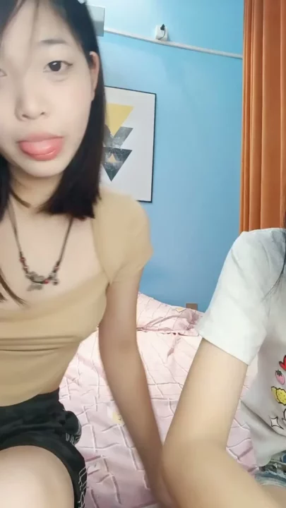 Screenshot 6 from Petite East Asian Twins in Raw Hotel Lesbian Encounter — Full Face Visible