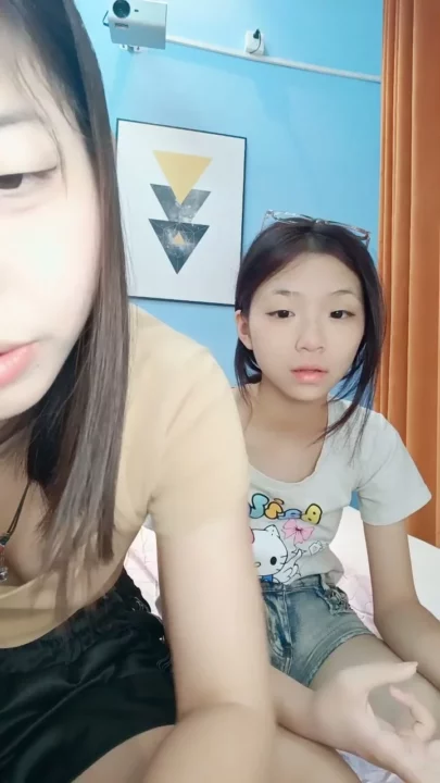 Screenshot 9 from Petite East Asian Twins in Raw Hotel Lesbian Encounter — Full Face Visible