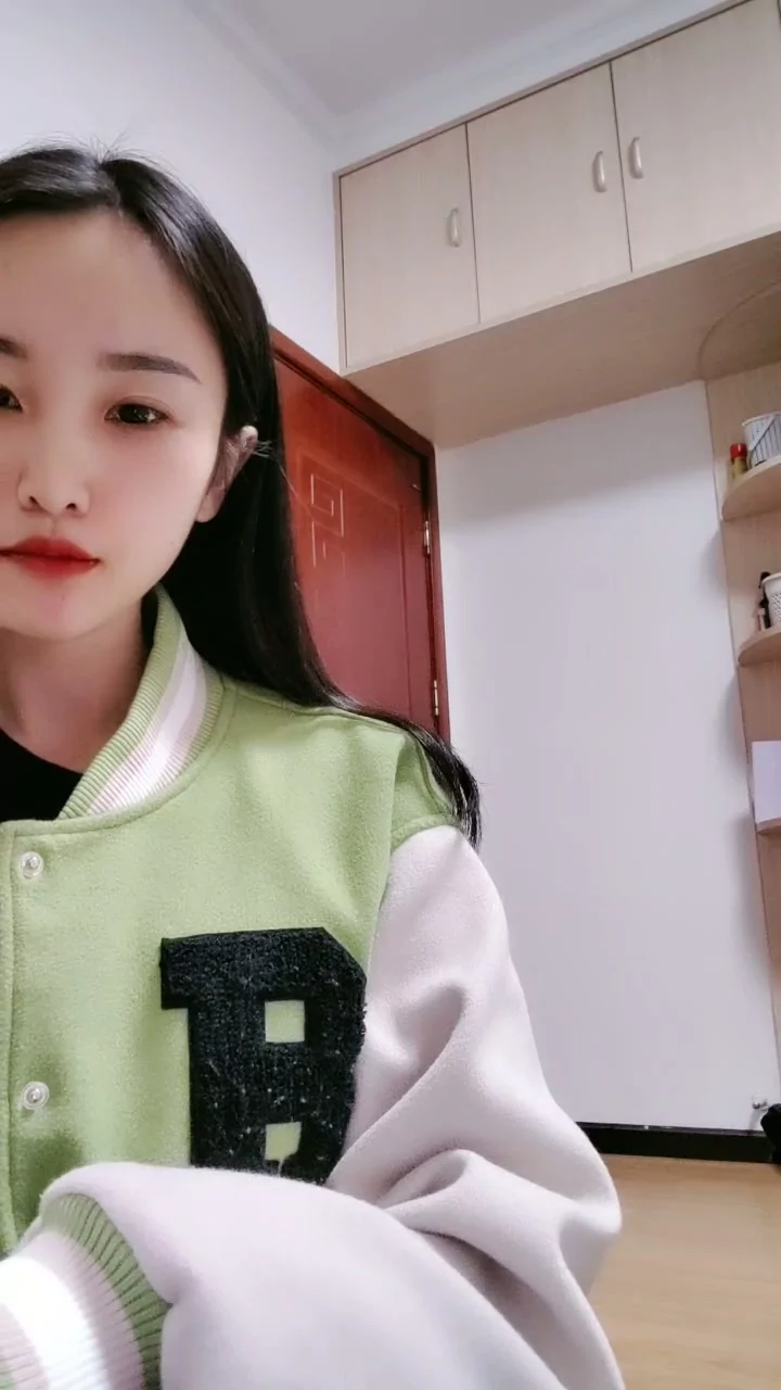 Play video: Solo Asian Beauty Models Varsity Jackets in Dorm Room Tease